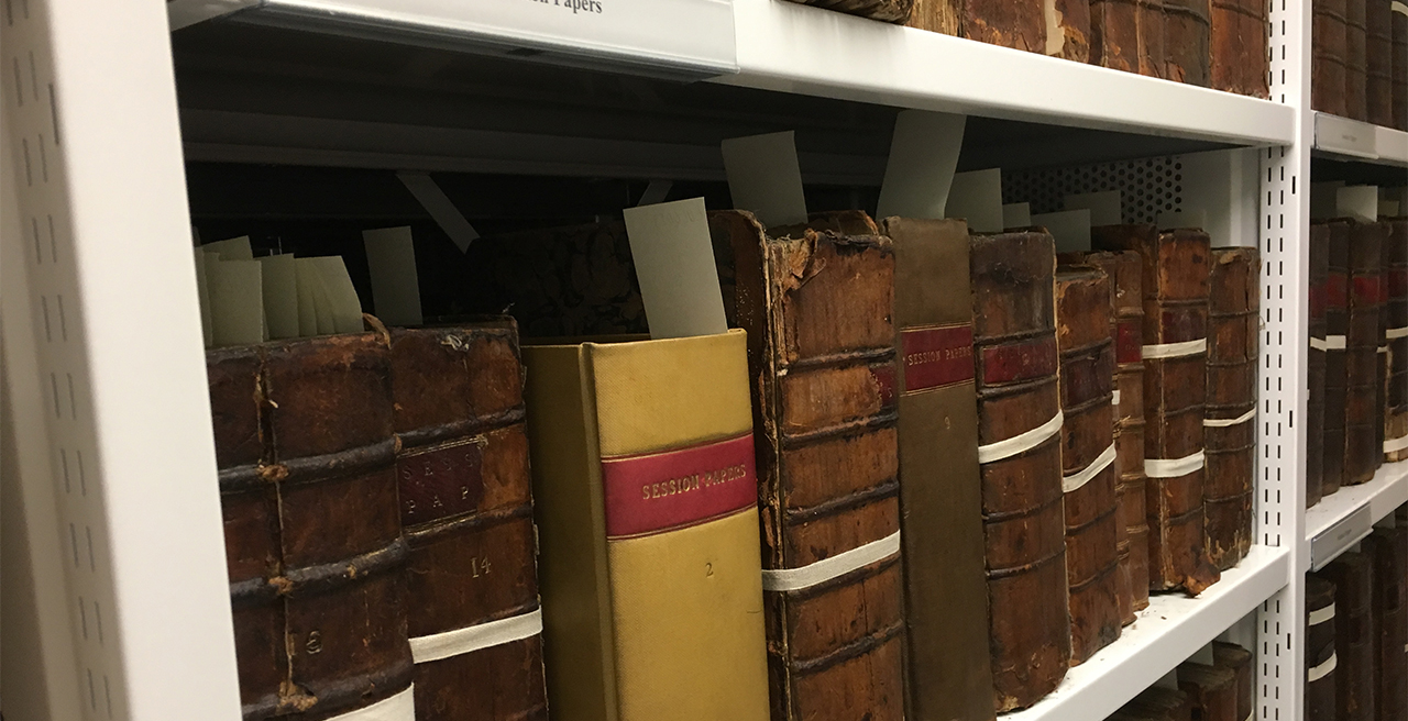 Archival storage shelfs at University of Edinburgh holding Session Papers